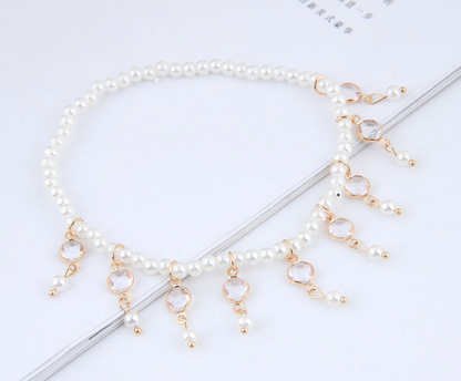 Close-up shot highlighting the delicate pearl tassels on the Pearl Tassel Anklet and Pearl Anklet.