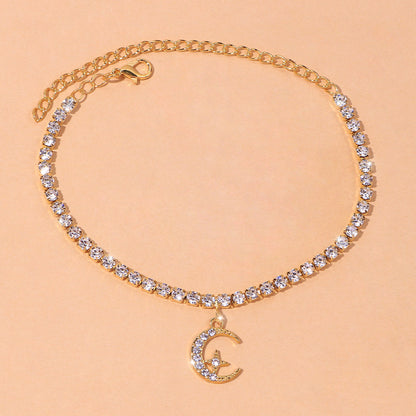 Star Moon Anklet featuring sparkling crystals and a crescent moon charm on a gold chain.