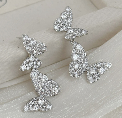 Silver Bow Pearl Stud Earrings