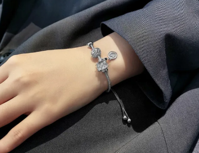 Close-up view of the Titanium Steel Zircon Flower bracelet showcasing the floral design.