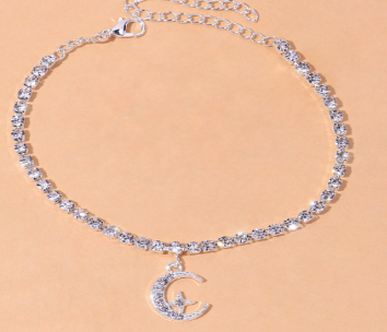 Star Moon Anklet featuring a silver chain with rhinestones and moon charm for a unique accessory style.